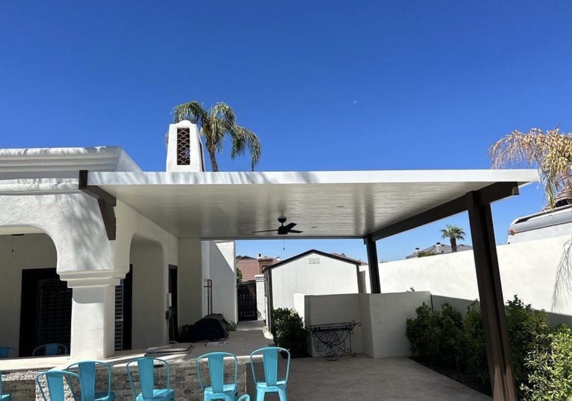 Modern solid top patio cover with TV wall by pool